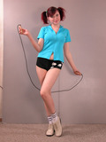 Sporty babe with big boobs poses with jumping-rope