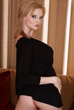Beautiful blonde teener Tarra White posing fully clothed in black dress