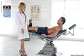 Blonde nurse Erica Foutos giving a muscular patient a blowjob
