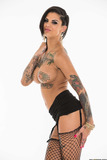 Tattooed slut Bonnie Rotten teasing in super sexy fishnet stockings