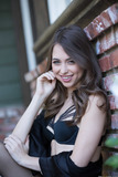 White girl Riley Reid models outdoors in black lingerie with matching hosiery
