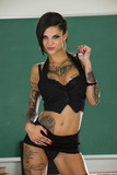 Tattoo model Bonnie Rotten wiggles her way free of clothing at teacher's desk