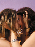 Hot lesbian girls on the bed have fun