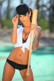 Tattooed softball player Angelina Valentine strips naked atop home plate