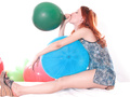 Redhead chick has fun with balls
