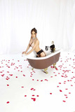 Solo girl Brandy Aniston shows off her big boobs in a clawfoot bathtub