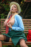 Busty blonde Michelle Thorne shows off her private parts on a garden bench