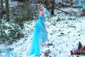 Yuffie Yulan cosplays Elsa from Frozen while displaying her big tits outdoors