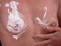 Naked babe has fun with foam