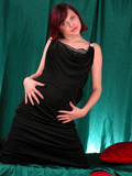 Busty redhead babe in black dress