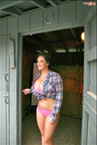 Chesty pornstar Sarah Nicola Randall modelling topless outdoors
